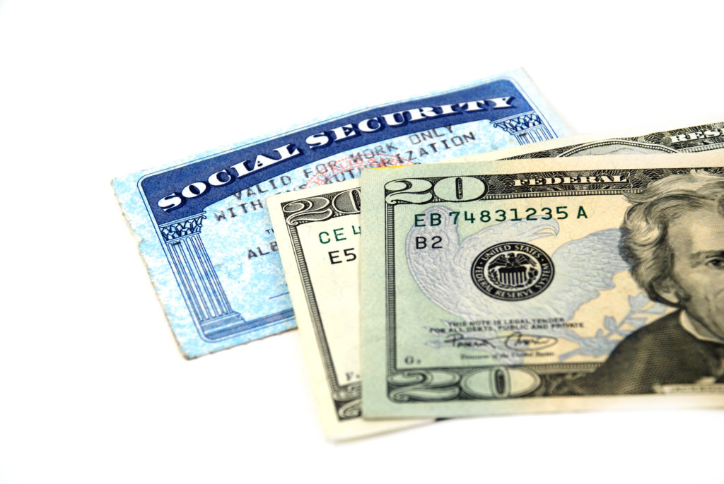 stock pictures of a social security card and money